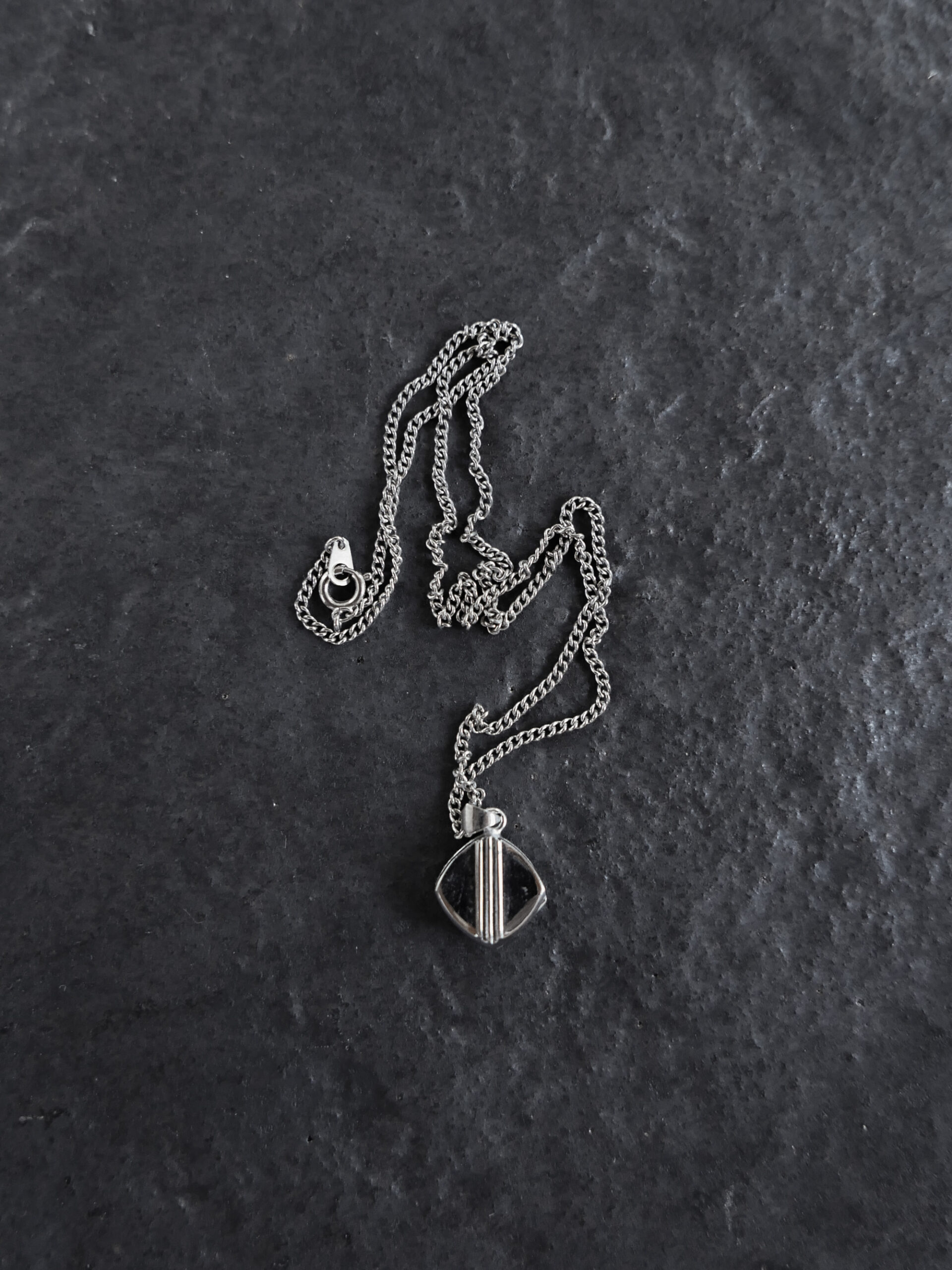 Tiny diamond-shaped locket