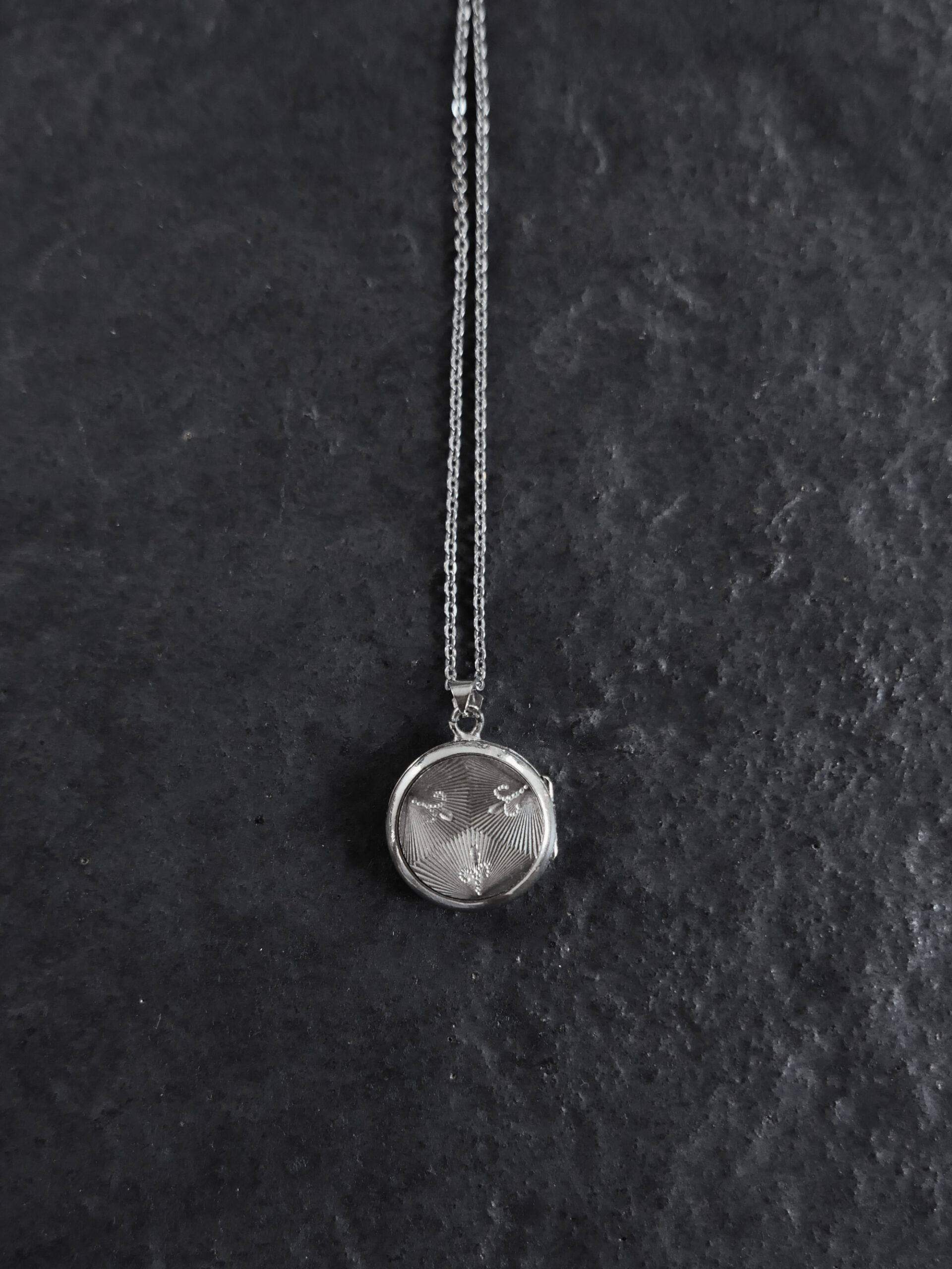 Fleur-de-lis locket pendant